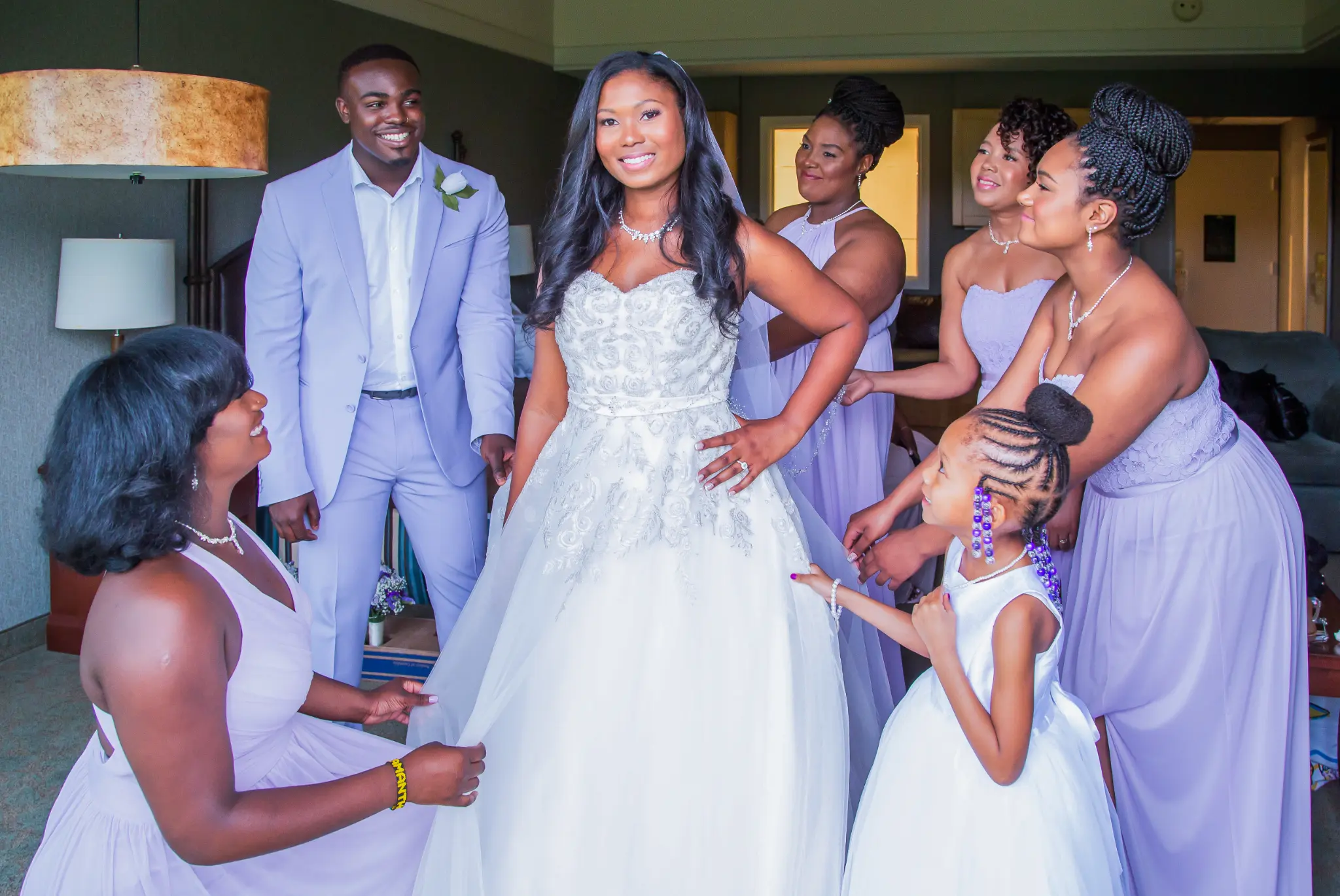 Bride surrounded by family and bridesmaids before the ceremony