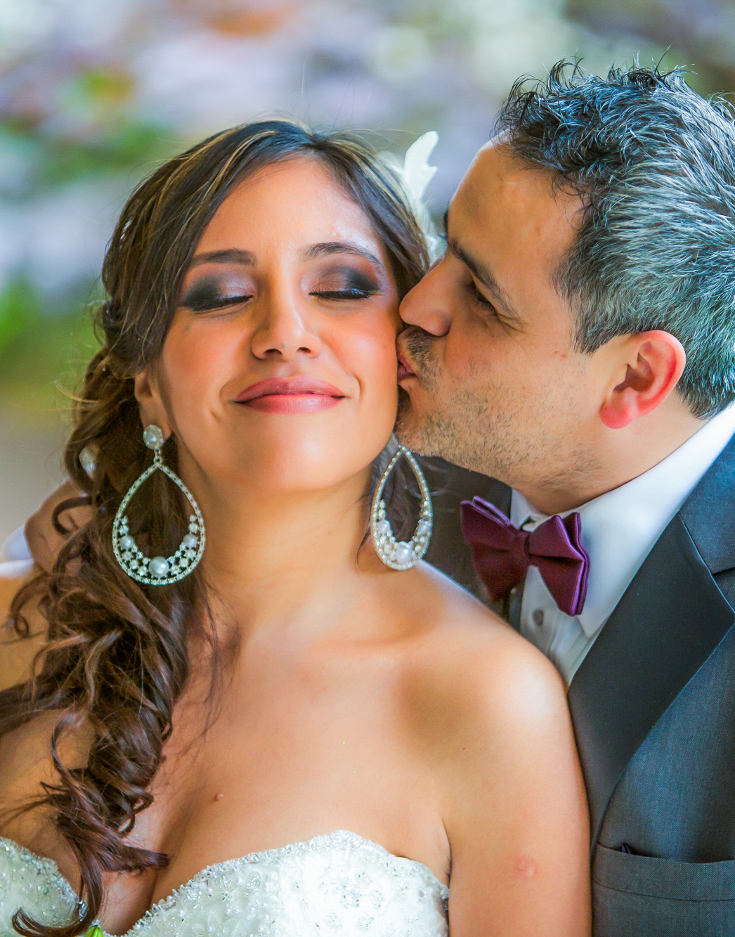 Groom kissing bride on the cheek — intimate Latin couple portrait — Andrew Rozario wedding photographer